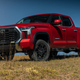 2022 Toyota Tundra with lift kit in red.